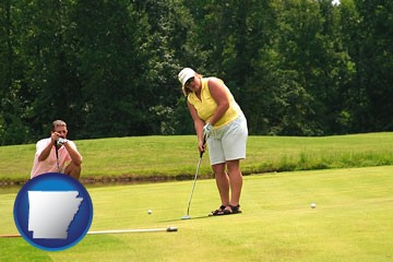 a golf putting lesson on a golf course - with Arkansas icon