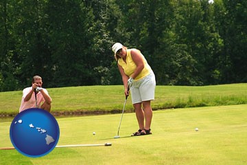 a golf putting lesson on a golf course - with Hawaii icon