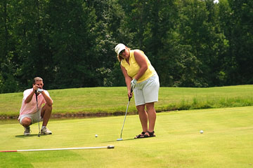 a golf putting lesson on a golf course